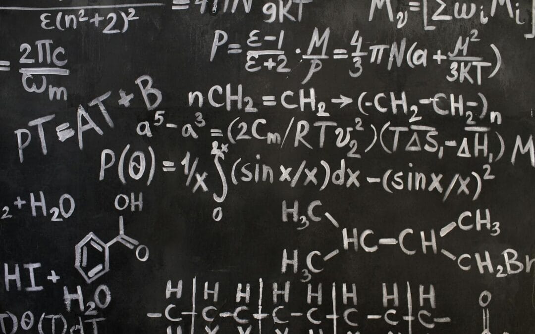 close up of complicated equations written on a blackboard