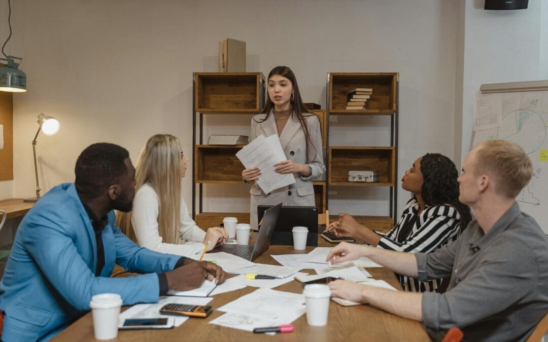 woman in gray blazer doing a report