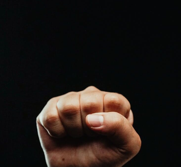 close up photo of a person clenching his fist