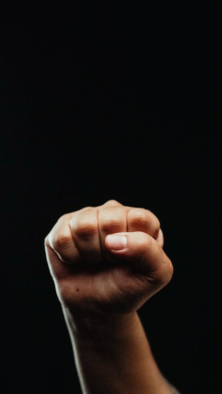 close up photo of a person clenching his fist