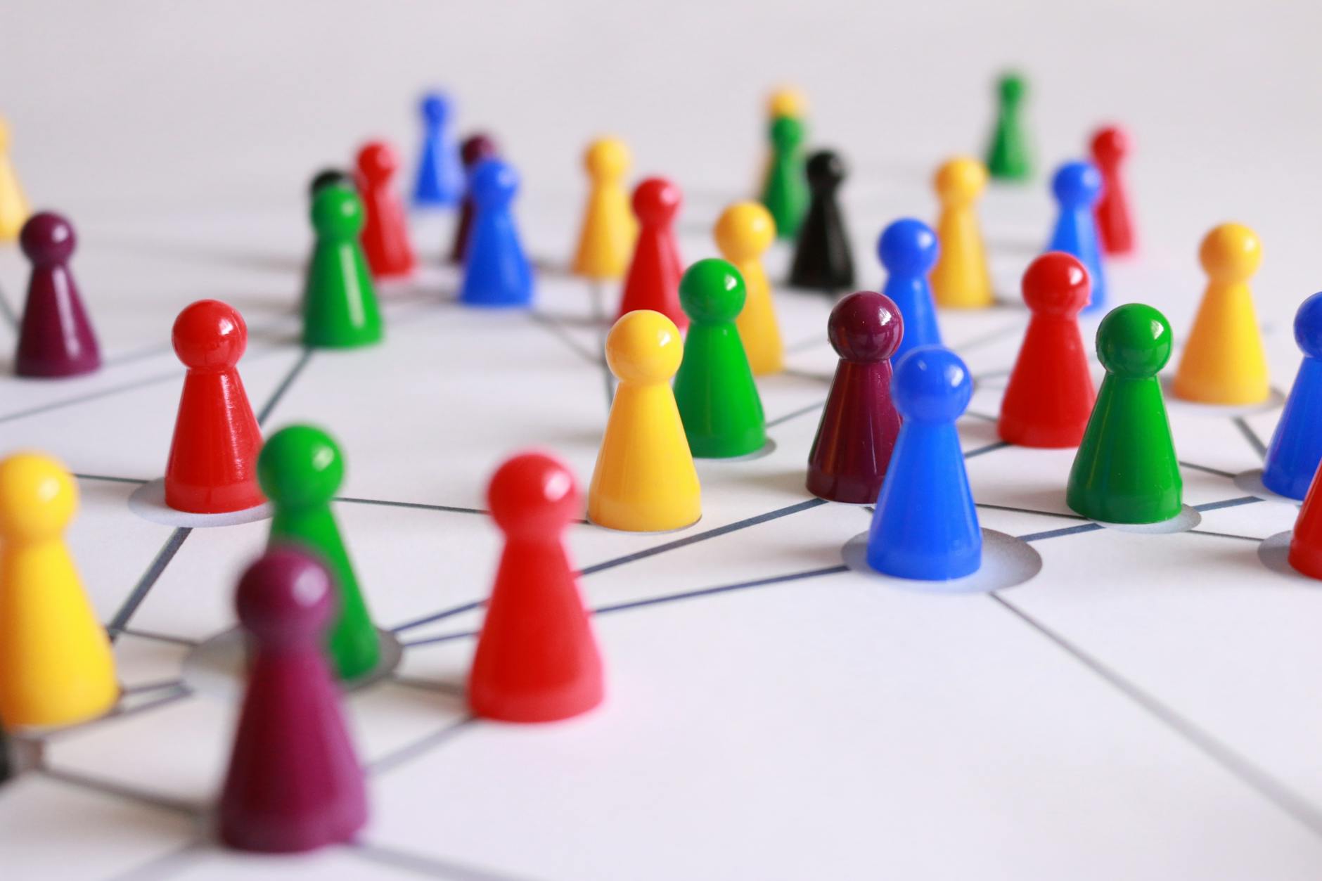 play-stone-network-networked-interactive-163064 close up photography of yellow green red and brown plastic cones on white lined surface